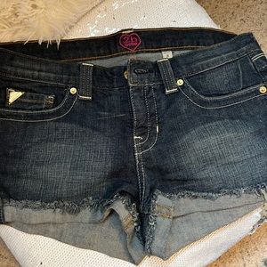 Only worn once BeBe shorts with gold bling butterflies on the back. Priced to go